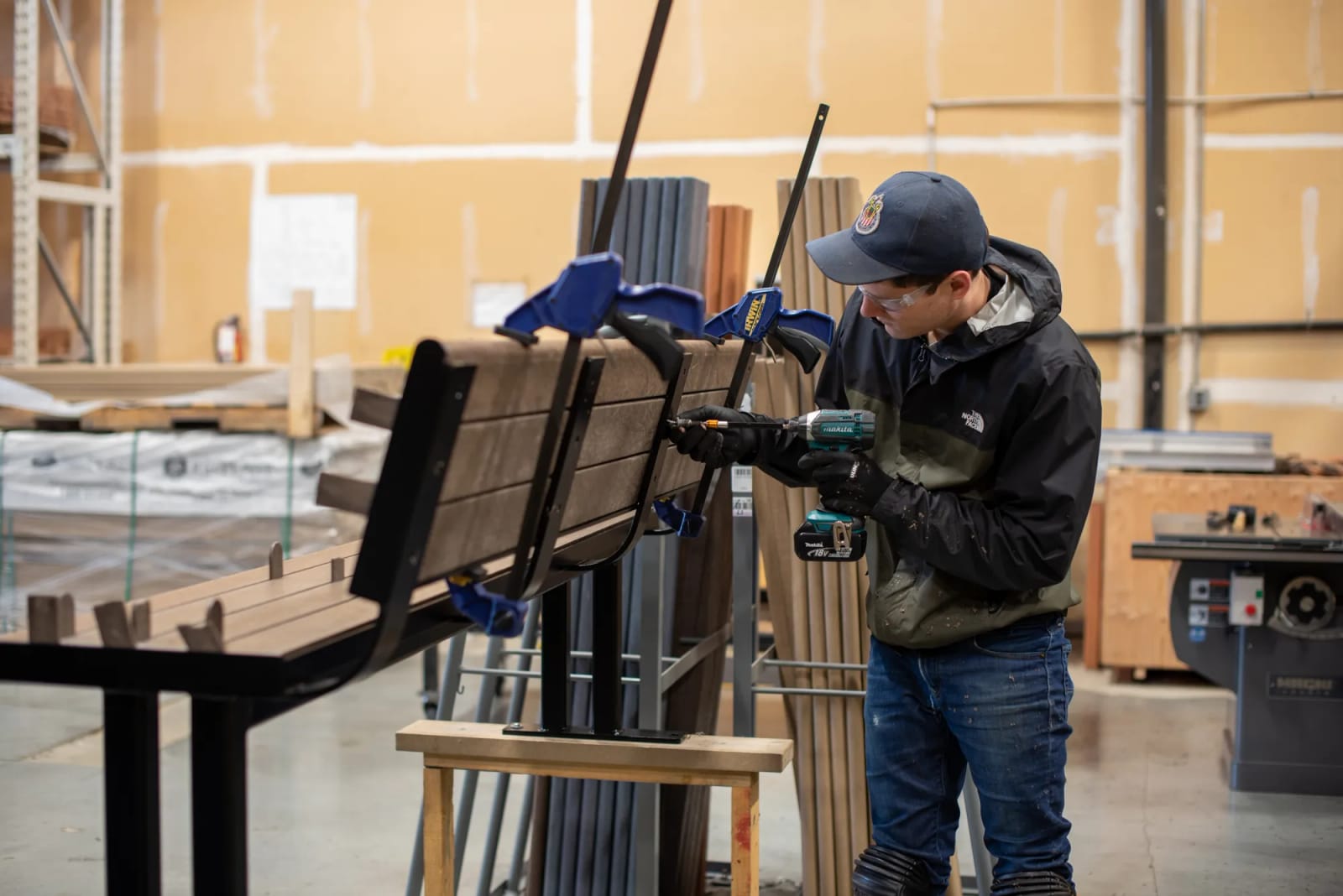 Fitting recycled plastic lumber slats to a powder-coated bench frame